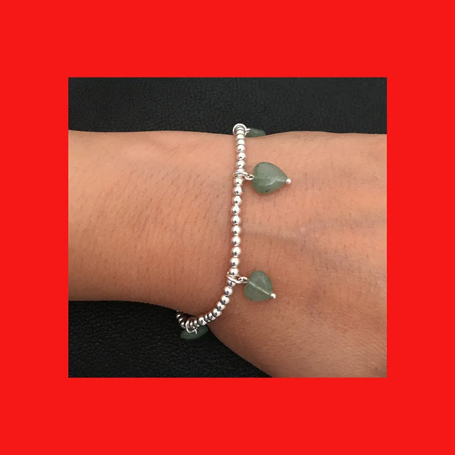 Bracelets; Elastic silver balls and heart dangles